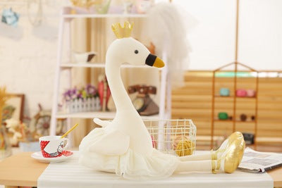 white flamingo plush toy with crown