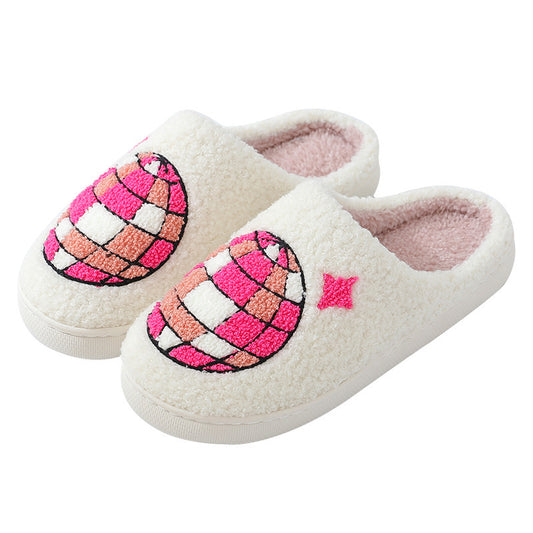 Pair of white slippers with pink disco ball