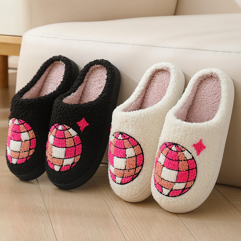 Pair of black slippers and a pair of white slippers with disco ball