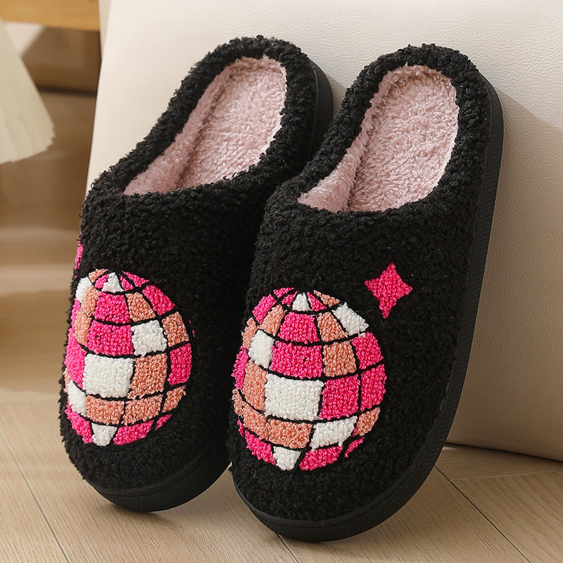 Black slippers with pink and white disco ball 
