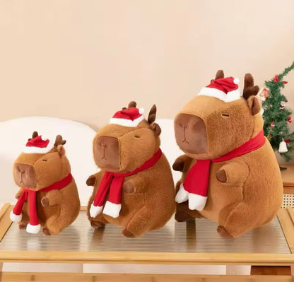 Festive capybara plush toy with reindeer hat and scarf for holiday decor - 3 sizes available