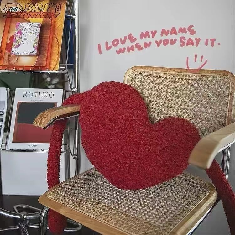 Asymmetrical red heart-shaped cushion