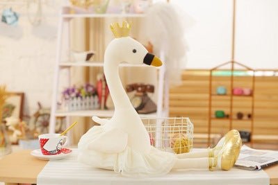 white flamingo plush toy with crown