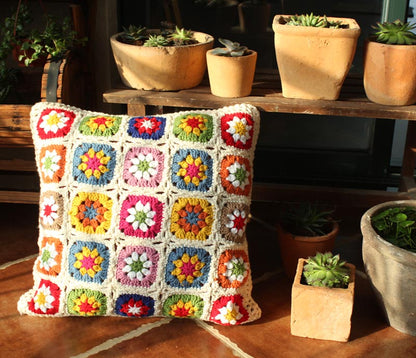 Beige crochet floral cushion for sofa or bed