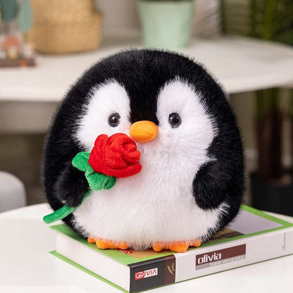 Black penguin plush toy with soft rose detail