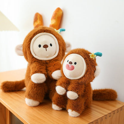 Fluffy brown monkey plush toy with changeable face