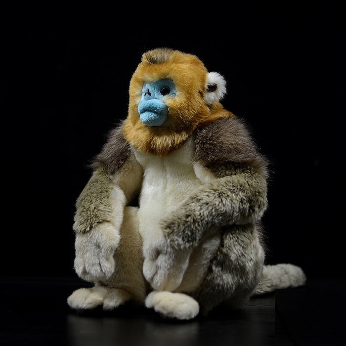 Golden monkey plush with distinctive blue face