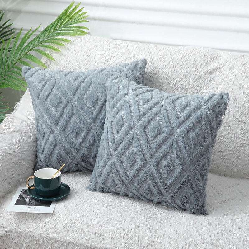 Grey rhombus textured cushion