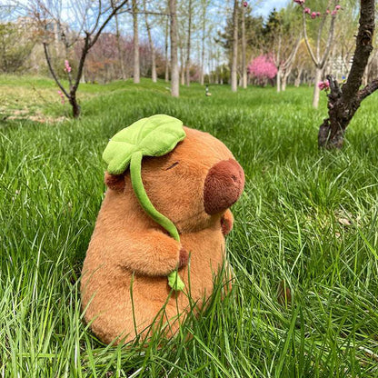 Large capybara plush toy with lotus leaf detail