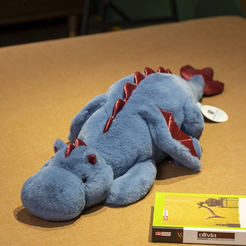 Large dinosaur plush toy in a lying dragon design