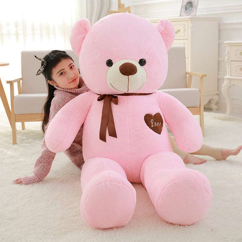 Large teddy bear with ribbons in a classic plush design