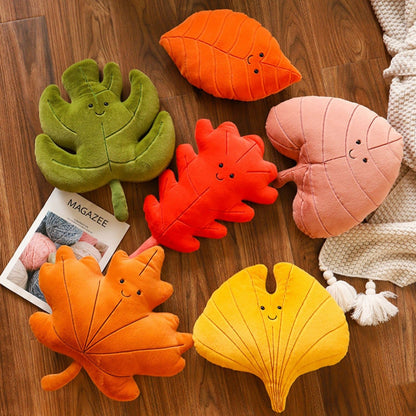 Leaf-shaped decorative cushion in available botanical designs