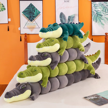 Long crocodile body pillow shown as an oversized plush display piece