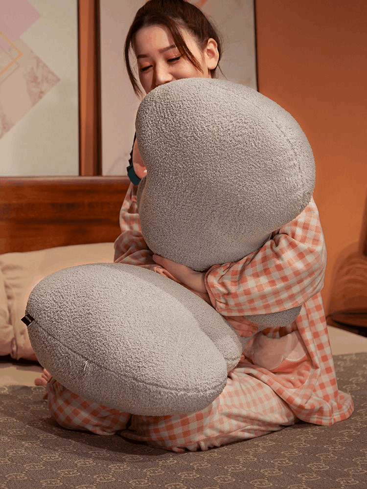 Long wave cushion styled on a sofa or bed