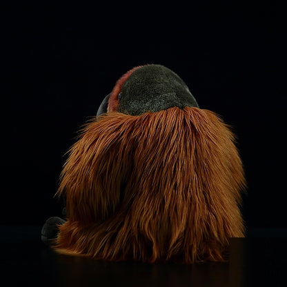Soft orangutan cuddly toy with lifelike face