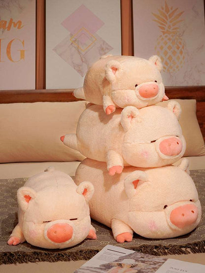 Pink pig plush cuddle toy with a rounded body