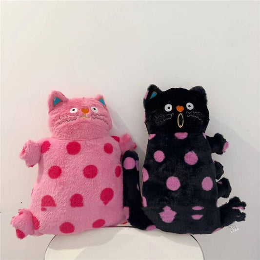 Polka dot cat plush pillow close-up