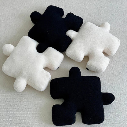 Puzzle piece cushion styled in a room setting