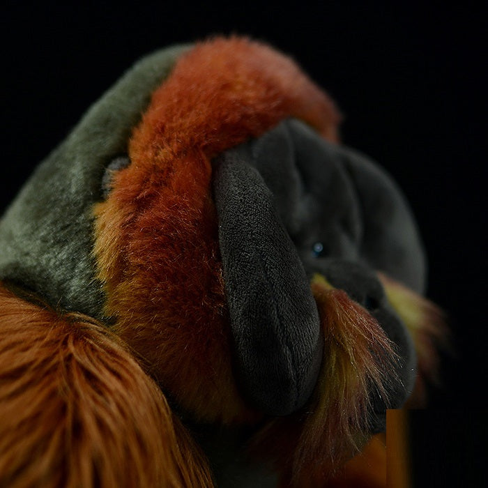 Realistic great ape plush toy with reddish brown fur