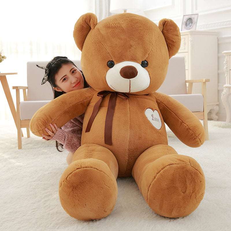 Ribbon teddy bear plush shown as a large display piece