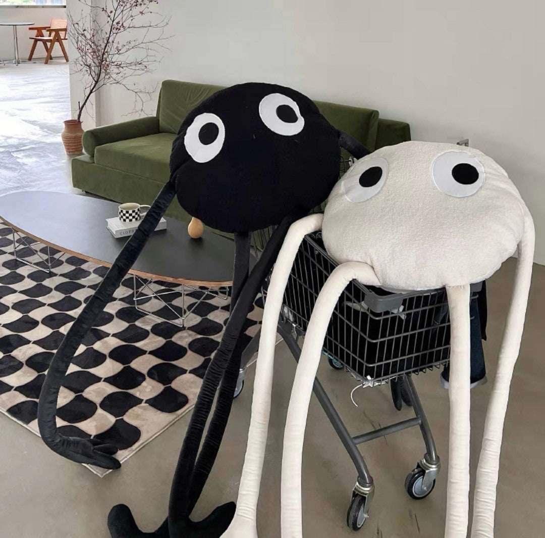 Shaggy octopus cuddly toy with large eyes