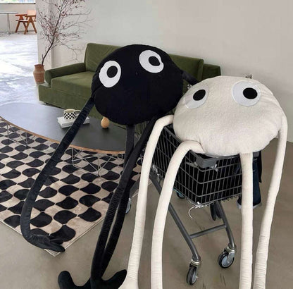 Shaggy octopus cuddly toy with large eyes