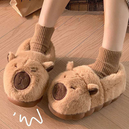 Brown squinty capybara plush house slippers worn indoors