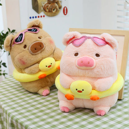 Pink pig plush wearing sunglasses and swim ring