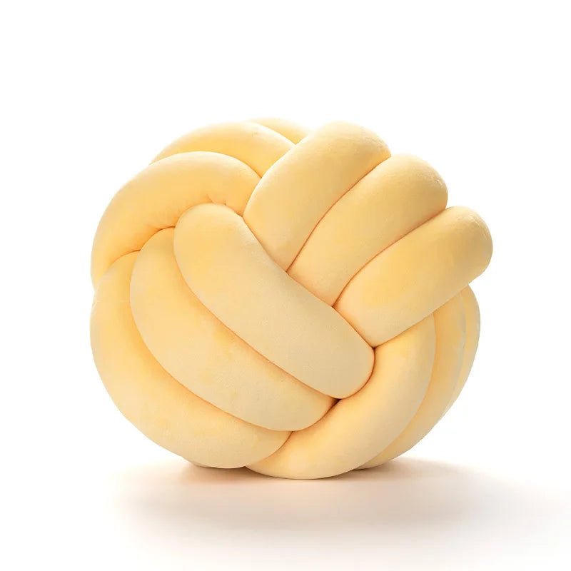 Yellow knot cushion