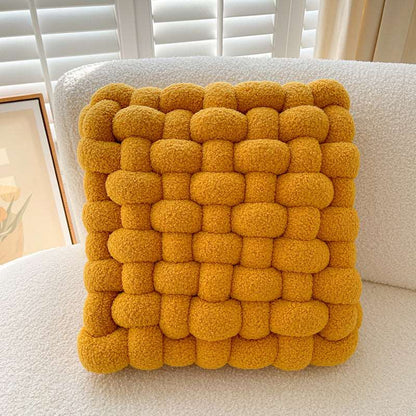 Yellow square knot cushion